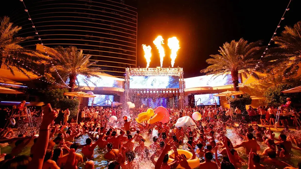 Encore Beach at Night venue video thumbnail with illuminated night-swim pool lighting and evening party atmosphere.